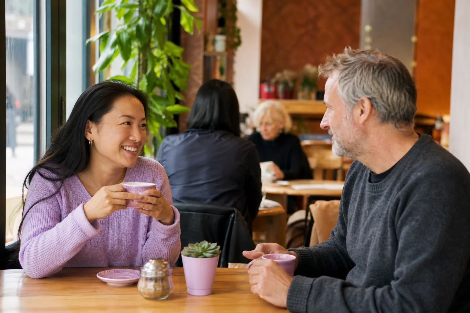 Two people talking over coffee at a café in Yorkshire